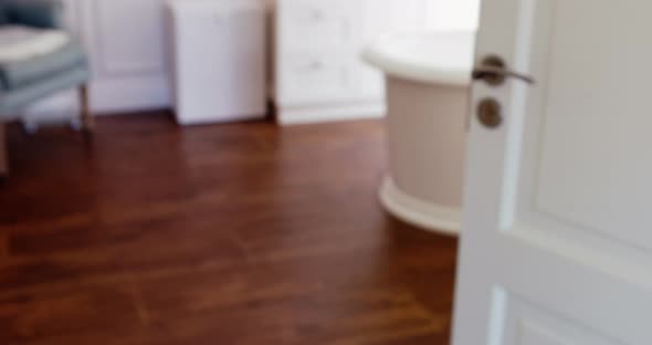 Son covering his eyes while watching television with father alt