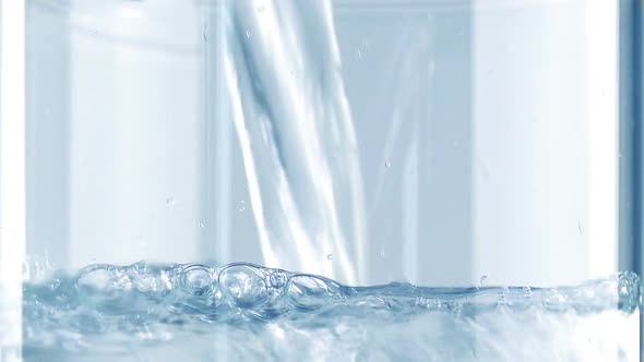 Water Fills Up Glass Macro Shot alt