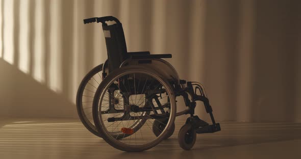 Empty Wheel Chair Parked in Hospital Emergency Department Corridor alt