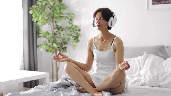 Woman in Headphones Relaxing Morning