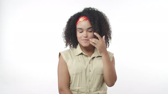 Attractive Sensual and Coquettish African American Girl on Date Smiling Silly Fixing Hair and Gazing alt