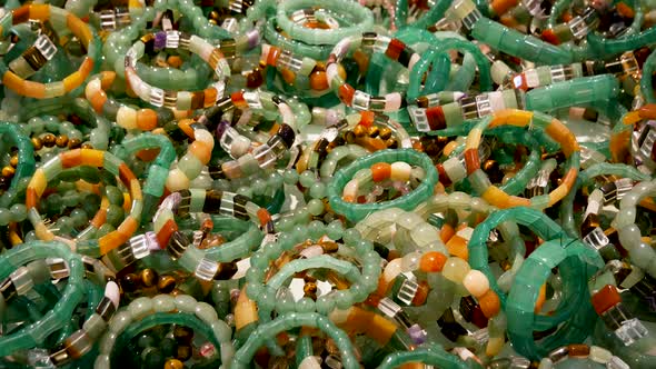Close Up Of Multi Colored Jade Wristbands alt
