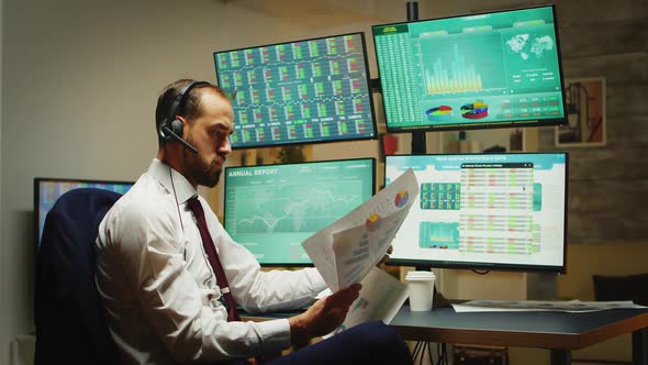 Angry Businessman Throwing Graphs in the Air alt