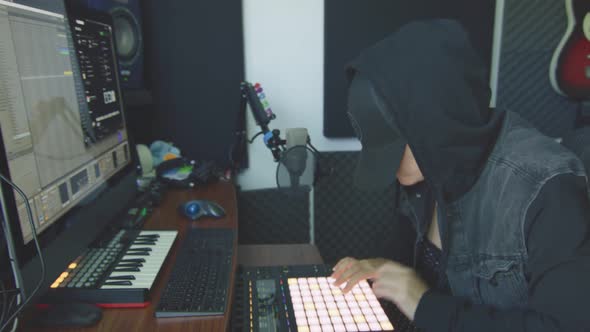 Slow Motion of Female Producer Working with Audio Controller alt
