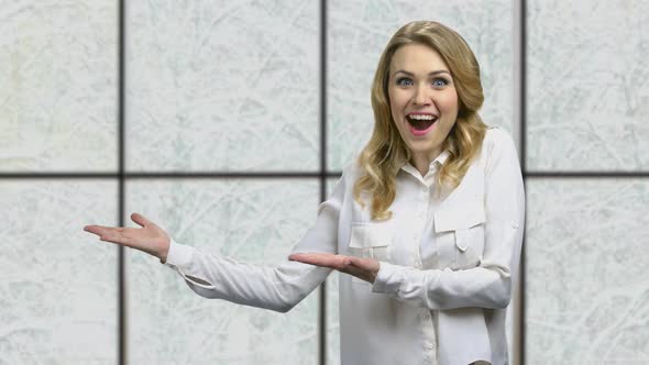 Young Shocked Business Woman Pointing at Copy Space alt
