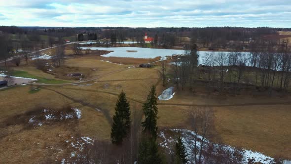 Araisi Lake Castle in Latvia Aerial Shot From Above. Historical Wooden Buildings on Small Island in alt