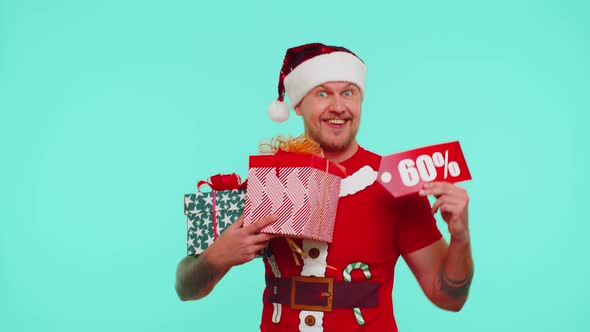 Man in Christmas Tshirt Showing Gift Boxes and 60 Percent Discount Inscriptions Banner Text Note alt