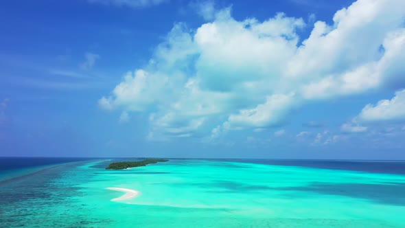 Aerial flying over panorama of relaxing coast beach holiday by transparent sea and white sandy backg alt