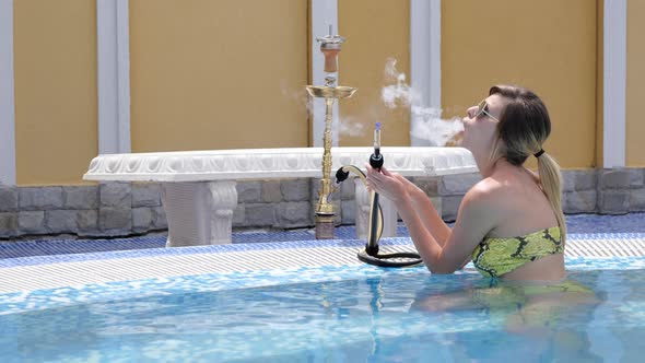 Girl Smoking Hookah in Pool