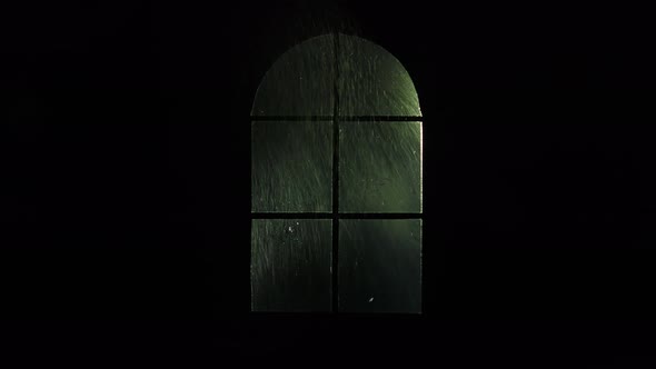 Window with raindrops and lightning.