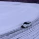Aerial view of the rally car on a snowy road - VideoHive Item for Sale