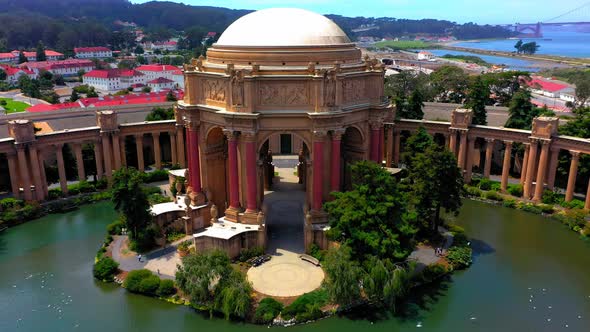 Close up drone shot flying away from the Palace of Fine Arts in San Francisco, California. alt