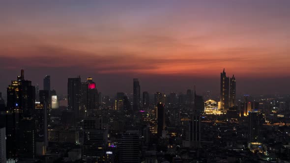 Bangkok business district city center and Chao Phraya River, day to night, zoom out – Time Lapse