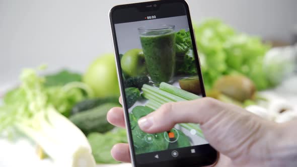 Woman Fitness Blogger Takes Photos of Fruits and Vegetables on Her Phone