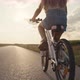 Close up of unrecognizable little caucasian girl riding a bike bike at sunset time. Shot with RED he - VideoHive Item for Sale