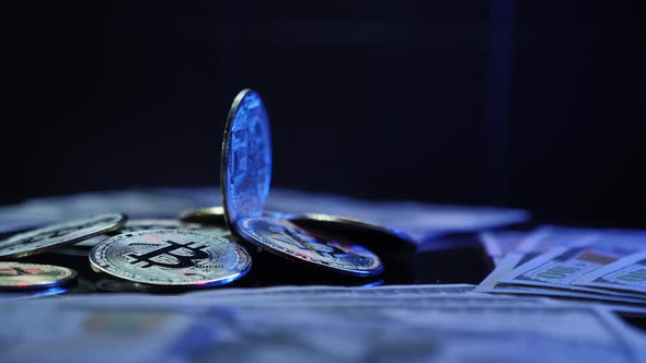 Blockchain. Bitcoin rotating on money and coins background. alt