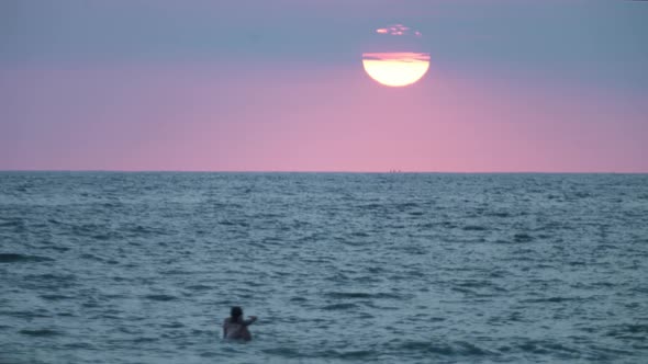 Beach sunset, surfer girl
