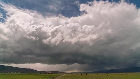 Thunderstorm rolling over the landscape towards and overhead alt