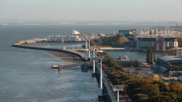 Timelapse of Cable Car Traffic Over Lisbon Waterfront, Portugal alt