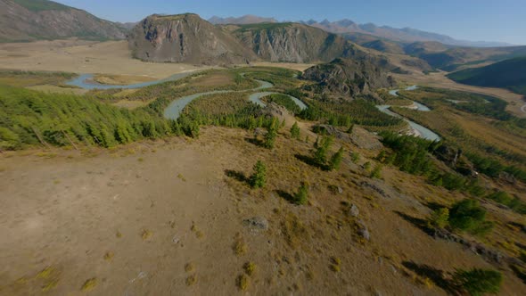 Aerial View Flight Over Natural River Meanders Water Stream Surrounded By Dense Autumn Spruce Forest alt
