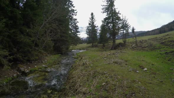 Drone Flying Over Mountain Rivulet Near Dolomites Landscape Italy alt