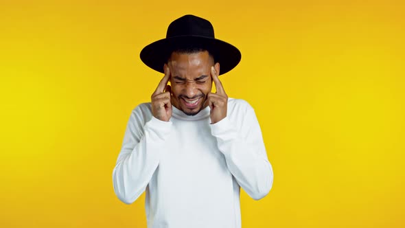 Young African Hipster Man Having Headache, Studio Portrait. Guy Putting Hands on Head, Isolated on alt