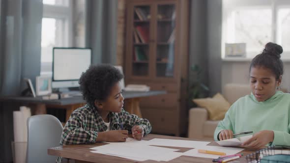 Afro Siblings Painting At Home Together alt