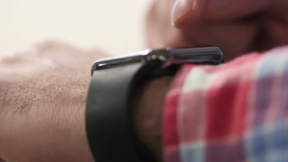 Man Using Smartwatch alt