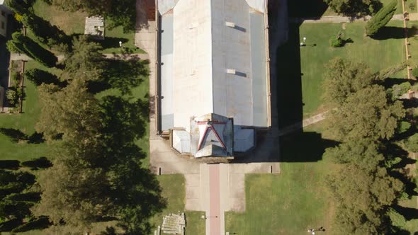 Aerial top down dolly in of an idyllic romantic style church surrounded by trees, Santa Anita, Entre alt