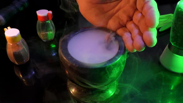 Magic mortar with smoke and magic bones. alt