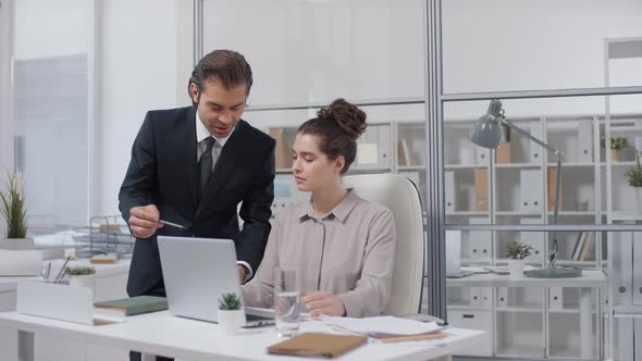 Female Boss Checking Documents alt