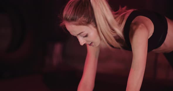 Athletic Female Actively Exercising at Gym. alt