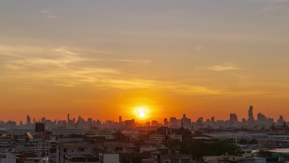 Sunrises over Bangkok downtown city center with Grand Palace and castle, night to day - time lapse