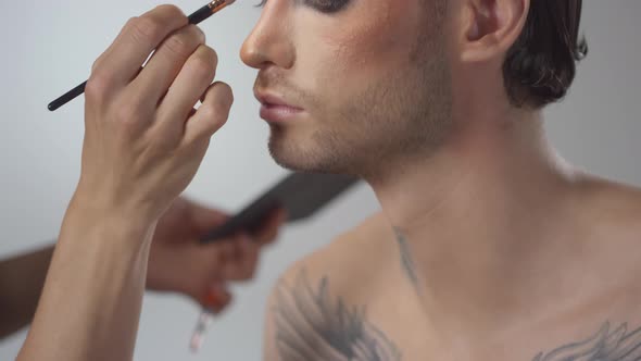 Putting Eyeshadow on Male Model alt