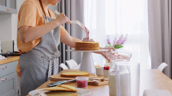 Woman Cooking Food and Baking on Kitchen at Home alt