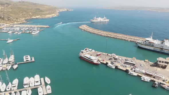 Aerial Clockwise Shot Of Mgarr Harbour In Gozo Malta alt