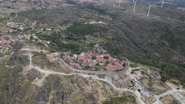 Orbiting shot of ancient hilltop fortified village of Sortelha, Portugal. Aerial view