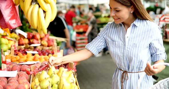 Picture of Woman at Marketplace Buying Fruits