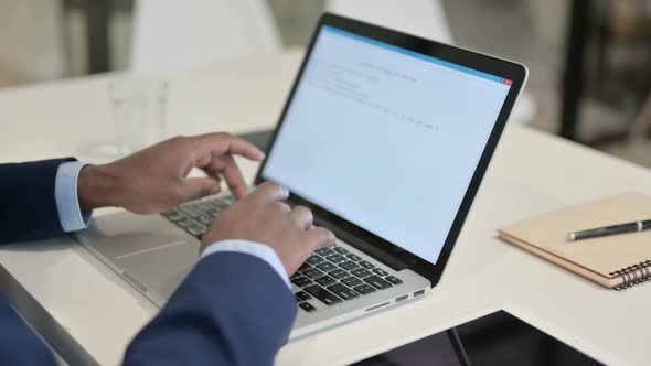 Businessman Typing on Laptop in Office Close Up alt