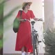 Wide Shot Confident Young Woman in Red Dress Sunglasses and Straw Hat with Bike Standing on Porch - VideoHive Item for Sale