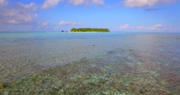 Aerial drone view of a scenic tropical island in the Maldives alt