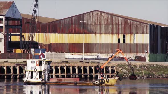 River Cleaning Boat in Riachuelo River, Buenos Aires, Argentina. alt