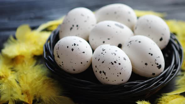 Whole Chicken Eggs in a Nest on a Black Rustic Wooden Background. Easter Symbols alt