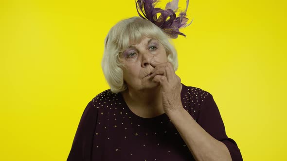 Funny Stupid Senior Old Woman Picking Nose with Silly Expression, Removing Boogers, Bad Manners alt