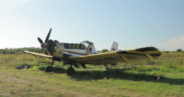 Old Colorful Plane with Wings Propeller Wheels Ready to Fly Standing alt