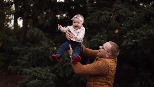 Baby Laughing While Father Throwing Up and Catching Child