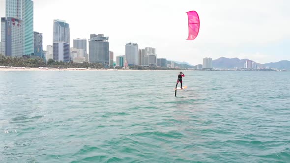 Kite Surfing Place, Sports Concept, Healthy Lifestyle, Human Flight. Aerial View of the City Beach alt