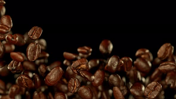Super Slow Motion Shot of Exploding Premium Coffee Beans Towards the Camera at 1000Fps alt