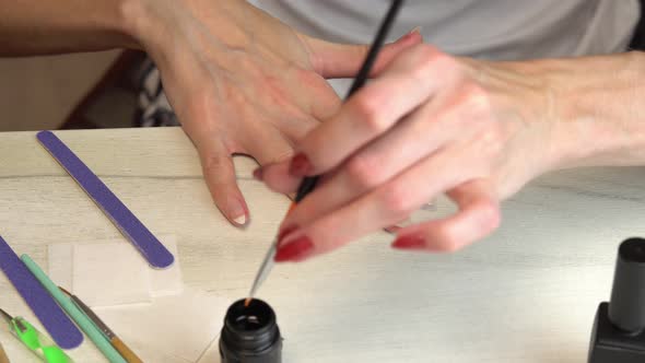 Applying a Base Coat Before Coating Nails with Nail Polish Self Manicure at Home alt