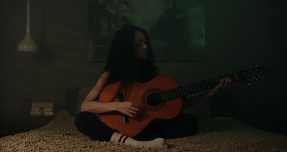 Young Woman Pretending To Play A Guitar